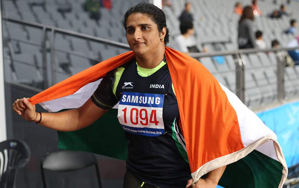 Seema Punia's celebrates after winning the gold medal in women's discus throw final at the 17th Asian Games in Incheon, South Korea.