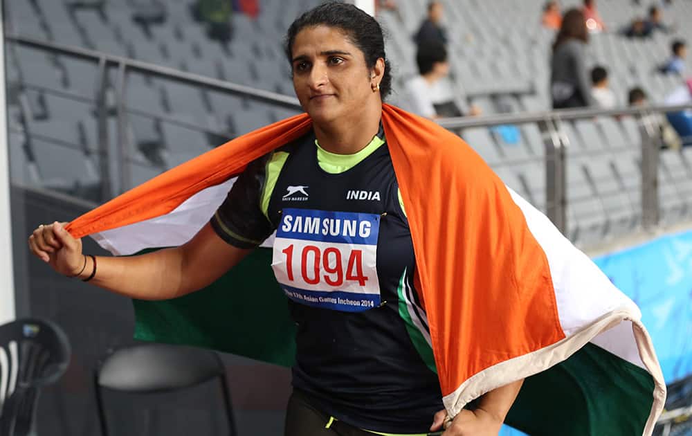 Seema Punia's celebrates after winning the gold medal in women's discus throw final at the 17th Asian Games in Incheon, South Korea.