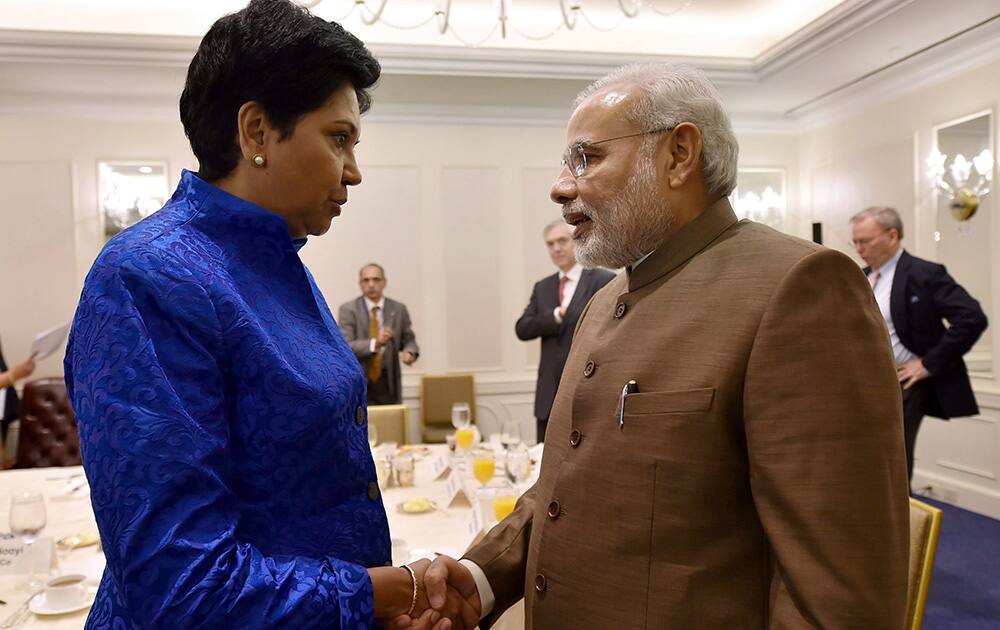 Prime Minister Narendra Modi shakes hands with PepsiCos Indian American chairman and CEO Indra Nooyi after a breakfast meeting in New York, US.