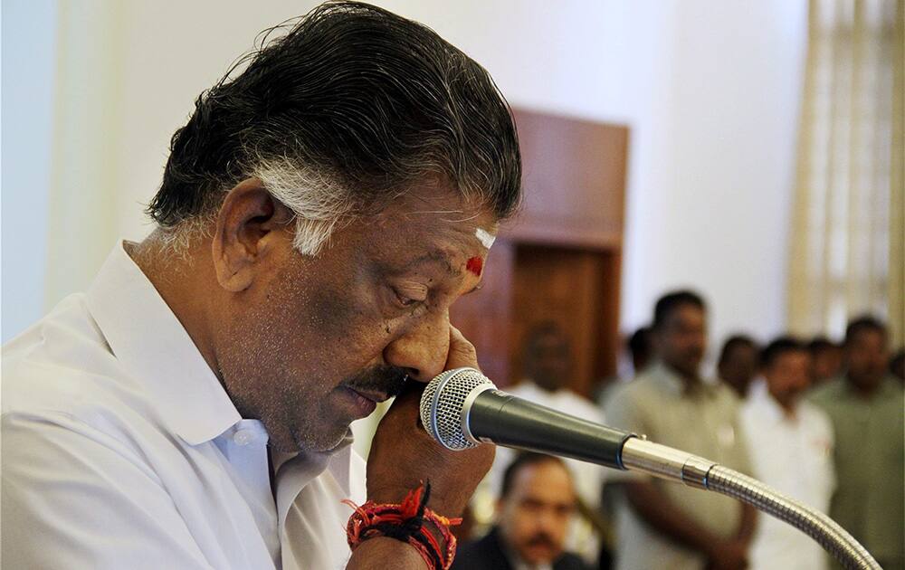 AIADMK leader O Panneerselvam gets emotional while taking oath as Tamil Nadu Chief Minister in absence of jailed party chief J Jayalalithaa at Raj Bhavan, Chennai.