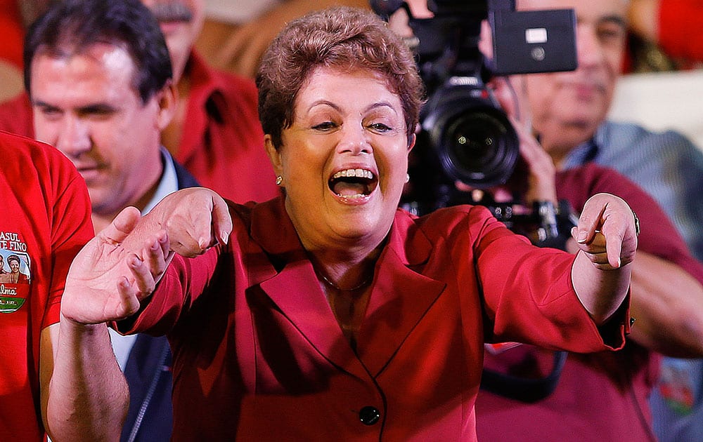 Brazil's President Dilma Rousseff, presidential candidate for re-election of the Workers Party (PT) gestures to supporters during a campaign rally in Sao Paulo, Brazil.