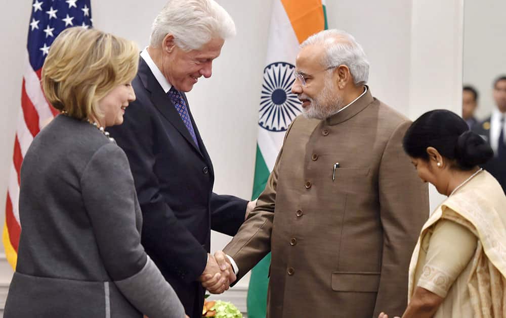 Prime Minister Narendra Modi and External Affairs Minister Sushma Swaraj exchanging greetings with former US President Bill Clinton and Hillary Clinton during a meeting in New York, US.