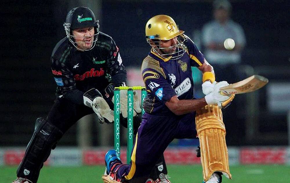 Robin Uthappa of the Kolkata Knight Riders plays a shot during CLT20 match against Dolphins at the Rajiv Gandhi Cricket Stadium in Hyderabad.