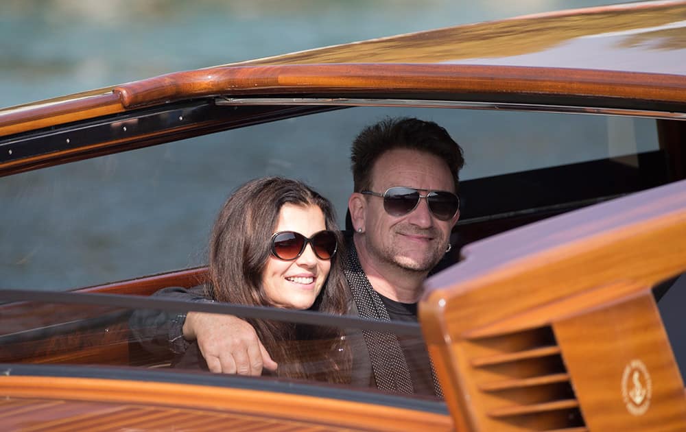 Singer Bono leaves the Cipriani hotel in Venice, Italy. Bono was among guests as George Clooney and Amal Alamuddin married Saturday, Sept. 27, the actor's representative said, out of sight of pursuing paparazzi and adoring crowds.