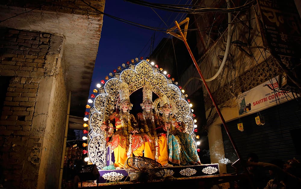 Artist dressed as Hindu gods take part on a Dussehra festival procession in Allahabad.