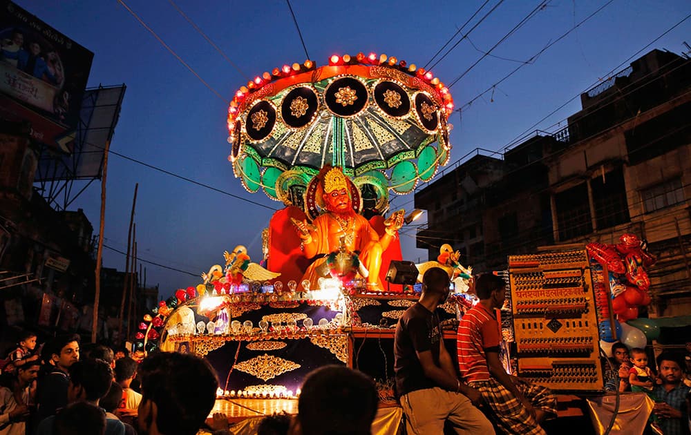 A tableau carries a portrait of God Hanuman during the Dussehra festival procession in Allahabad.