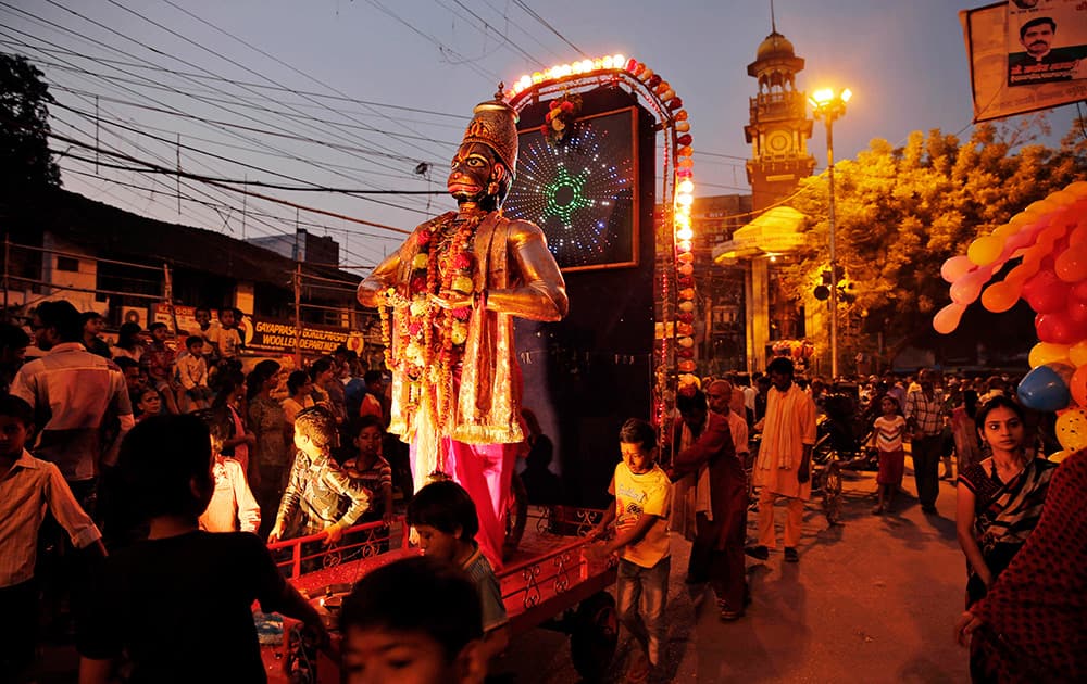 A tableau carries a huge idol of God Hanuman during the Dussehra festival procession in Allahabad.