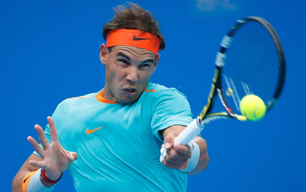 Rafael Nadal of Spain returns a shot from Richard Gasquet of France during the China Open tennis tournament at the National Tennis Stadium in Beijing, China.