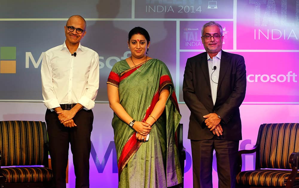 Chief Executive Officer of Microsoft Satya Nadella, Indian minister for Human Resource Development Smriti Irani and Chairman of Microsoft India Bhaskar Pramanik, pose for the media at the Talent India 2014 program in New Delhi.