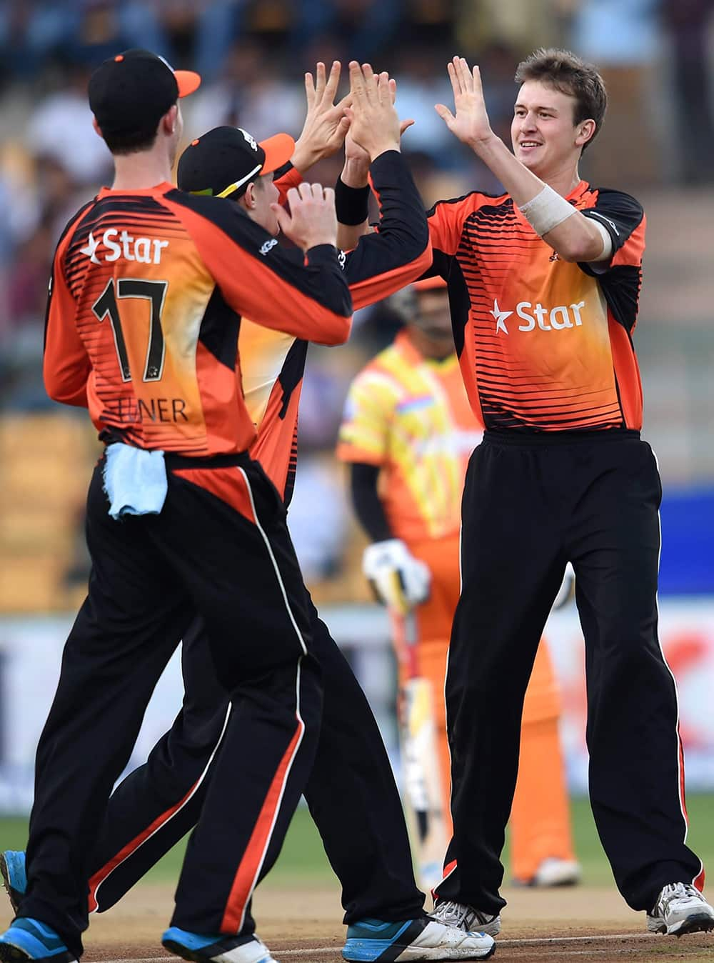 Perth Scorchers bowler Mitchell Marsh celebrates the wicket of Lahore Lions skipper Muhammad Hafeez during the Champions League Twenty 20 match at Chinnaswamy Stadium in Bengaluru.