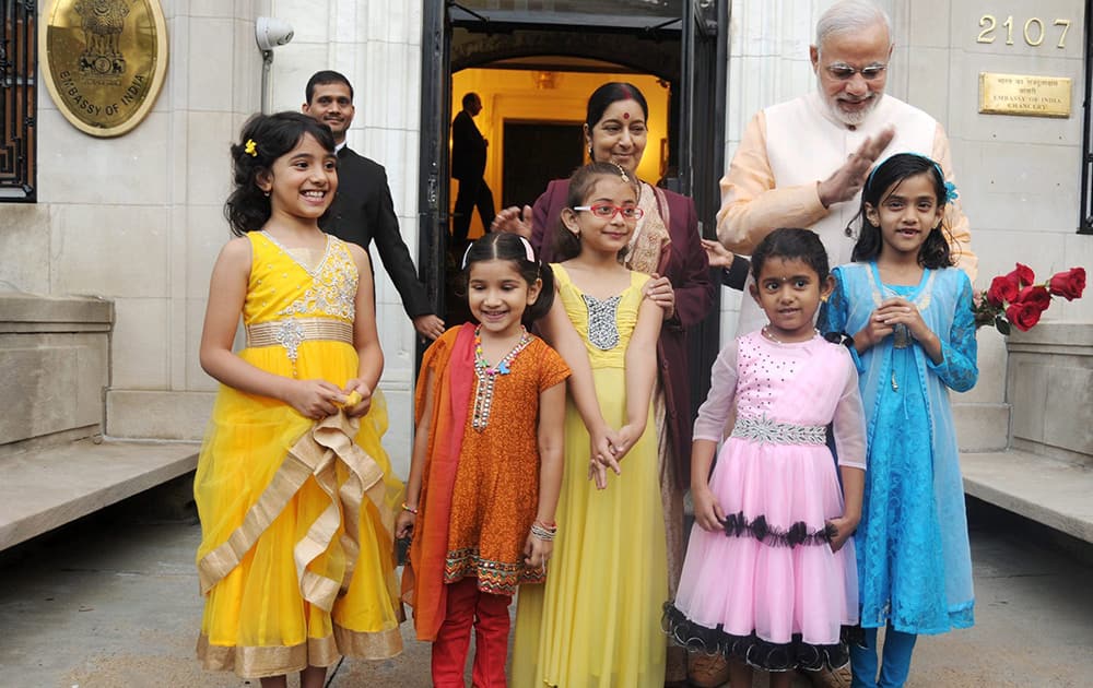 Prime Minister Narendra Modi and External Affairs Minister Sushma Swaraj interact with the children at Indian Embassy in Washington DC.