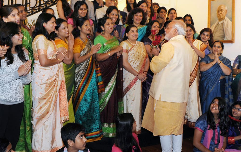 Prime Minister Narendra Modi interacts with the families of Indian officials at Indian Embassy in Washington DC.
