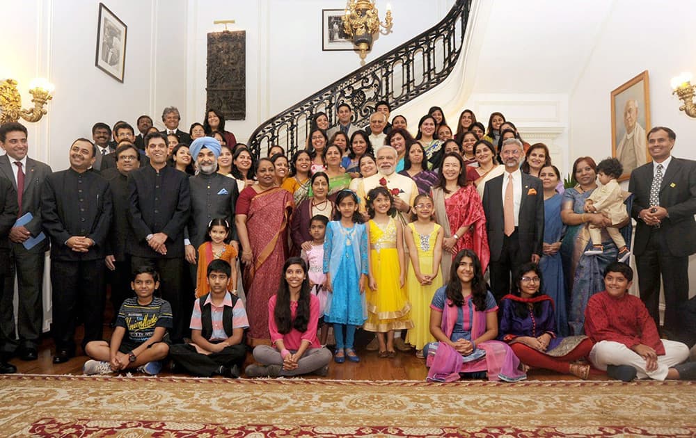 Prime Minister Narendra Modi poses for a group photograph with the families of Indian officials at Indian Embassy in Washington DC.