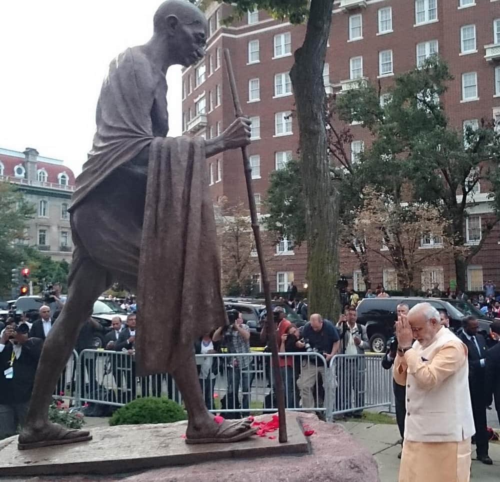Prime Minister Narendra Modi pays tribute to a statue of Mahatma Gandhi in Washington DC.
