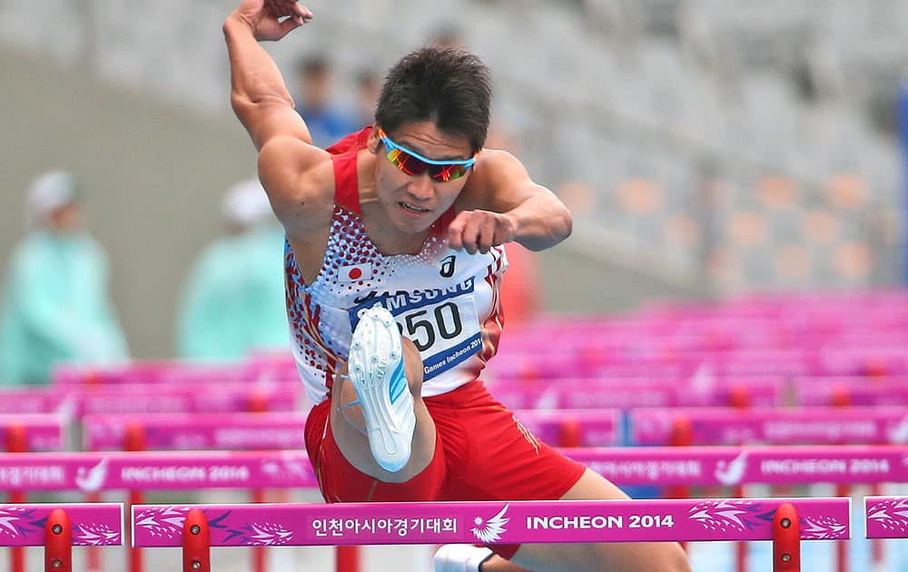 Japan's Akihoko Nakamura competes in the men's 110m hurdles heat two at the 17th Asian Games in Incheon, South Korea