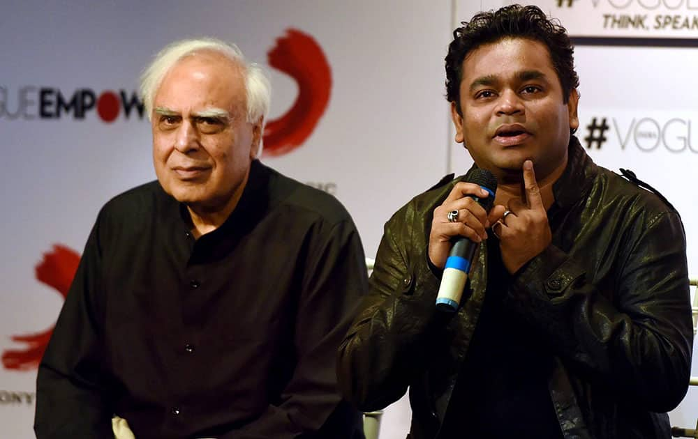 Former union minister Kapil Sibal looks on as music composer A R Rahman speaks during the launch of album Raunaq in Mumbai.