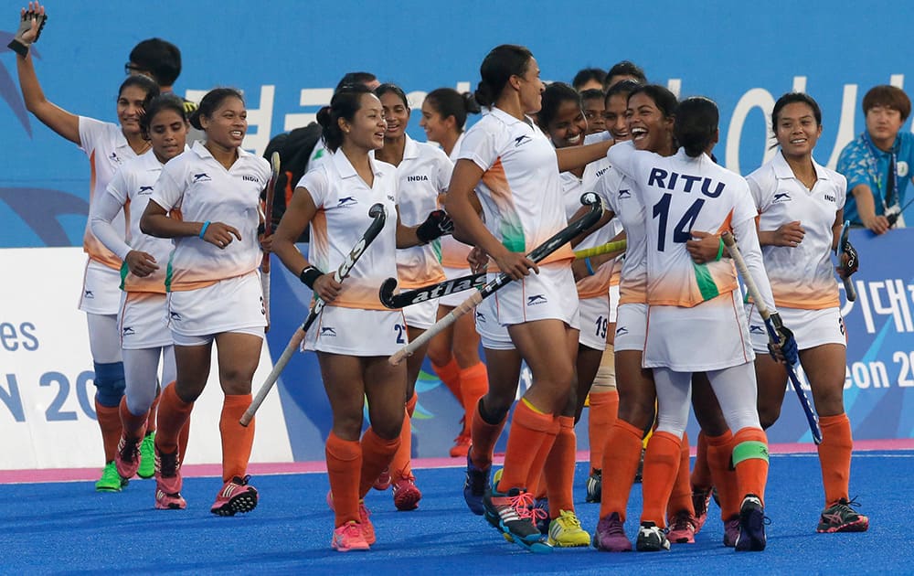 India's players celebrate their victory over Japan during their Women's Bronze Medal hockey match at the 17th Asian Games in Incheon, South Korea.