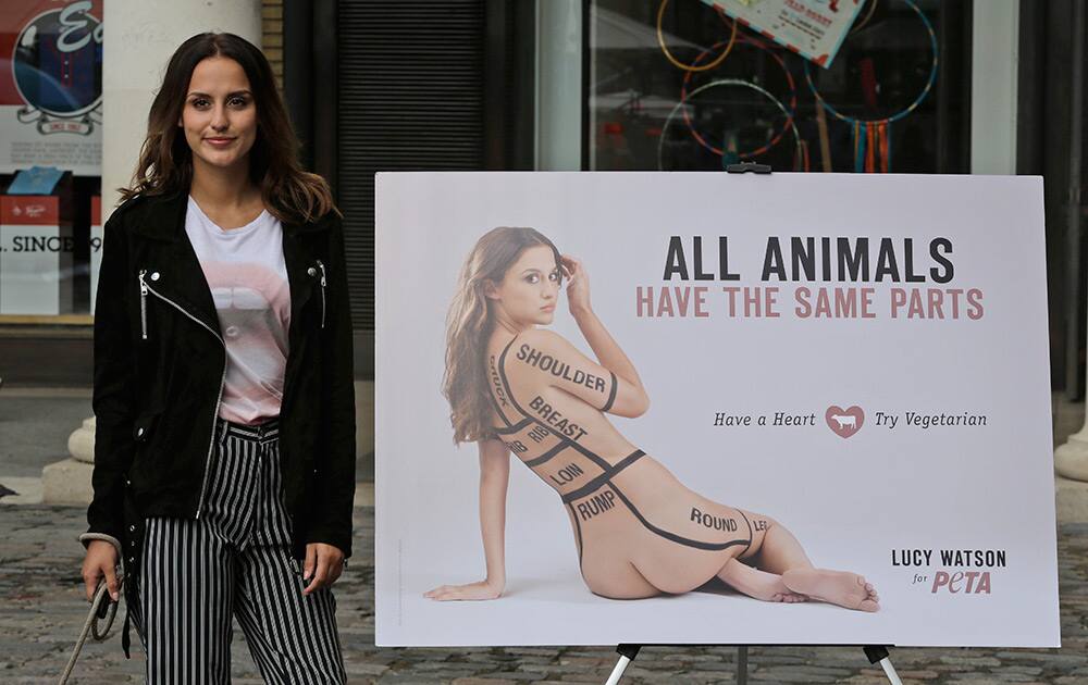 Lucy Watson, a British actress and model, poses for photographers with a campaign poster in central London's Covent Garden, for the new ad campaign for PETA (People for the Ethical Treatment of Animals) that proclaims, 'All Animals Have the Same Parts. 