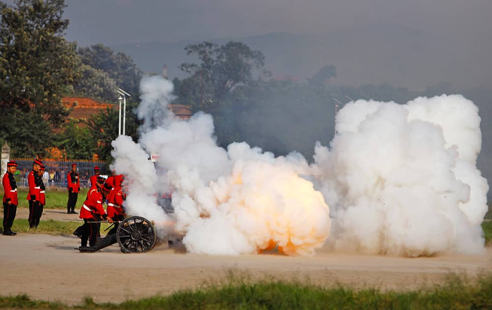 Nepalese army soldiers light a cannon on the seventh day of Hindu festival Dashain in Katmandu, Nepal.