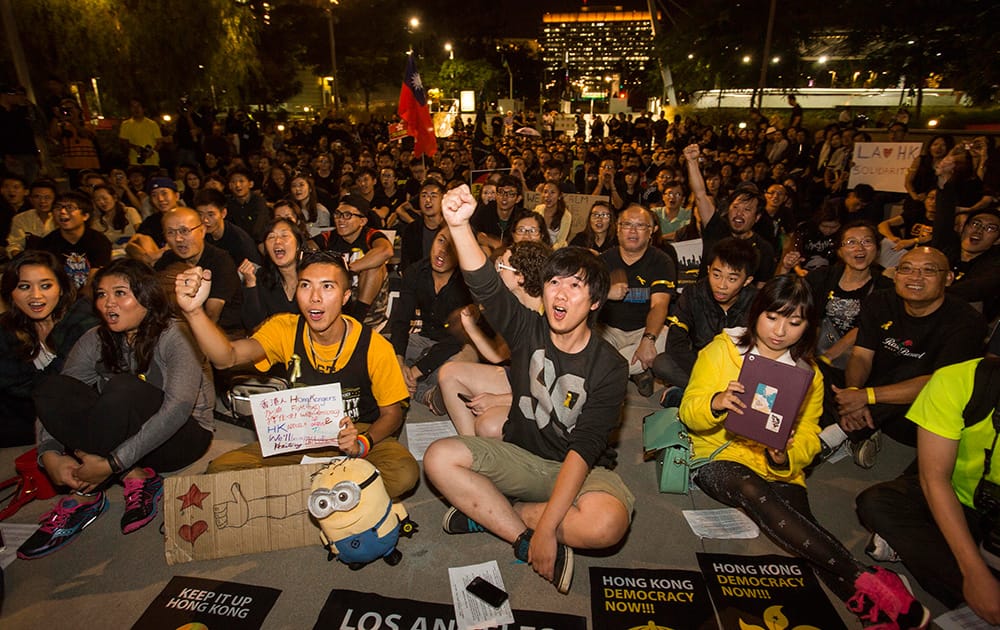 Hundreds of demonstrators at Grand Park downtown Los Angeles to show their support for the pro-democracy protesters in Hong Kong that have been dubbed the 'umbrella revolution', in Los Angeles.