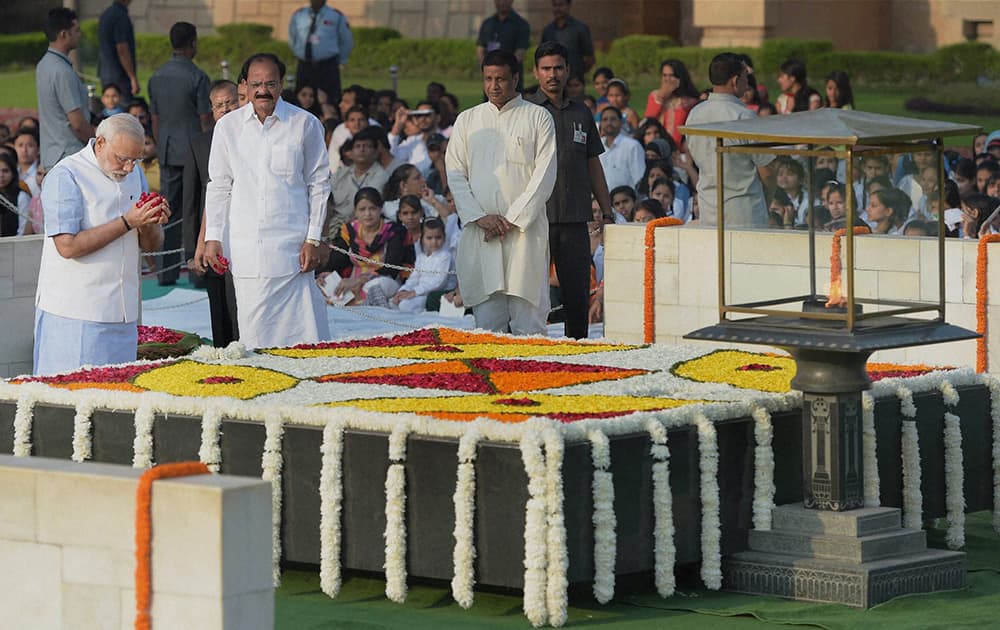 Prime Minister Narendra Modi paying homage to Mahatma Gandhi on the occasion of his 145th birth anniversary at his memorial Rajghat in New Delhi.