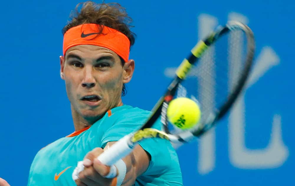 Rafael Nadal of Spain return a shot to Peter Gojowczyk of Germany during the China Open tennis tournament at the National Tennis Stadium in Beijing, China.
