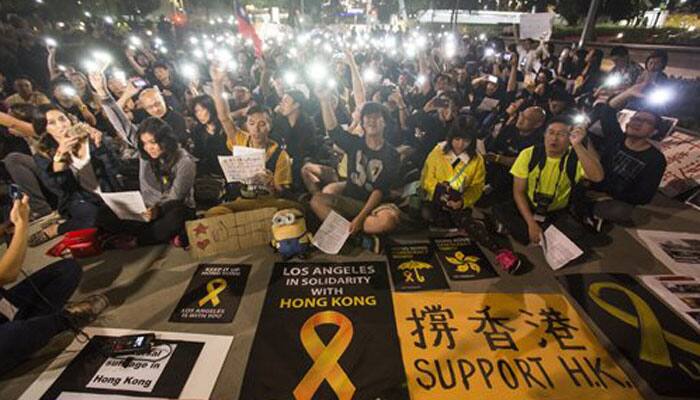 Hong Kong leader offers talks, rejects calls to stand down