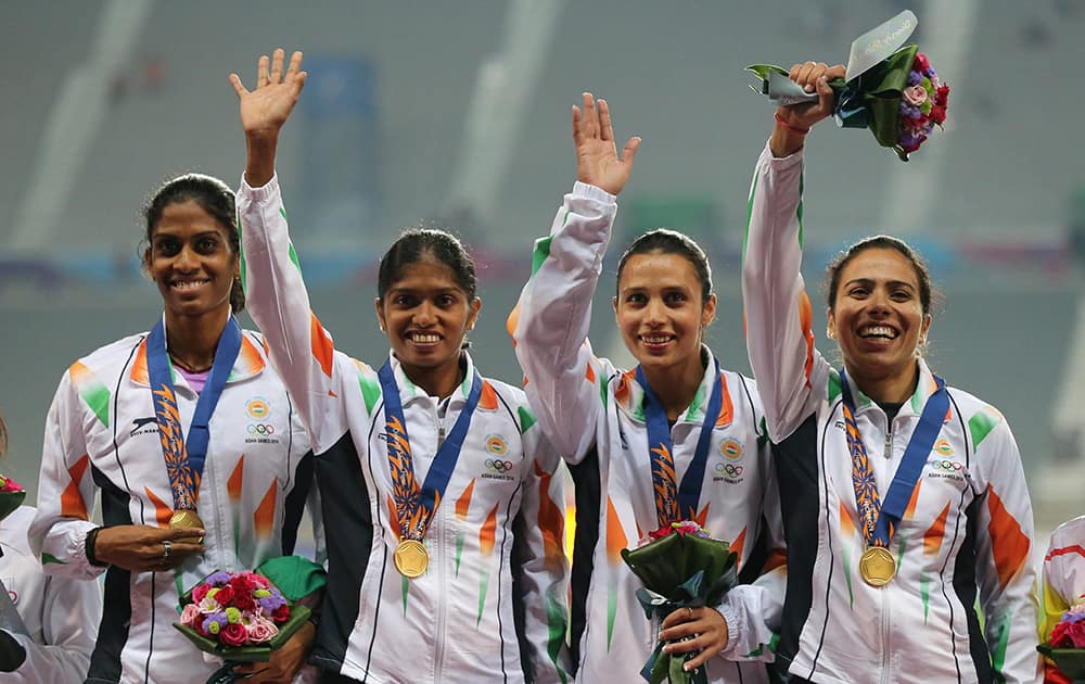 Indian team who won the gold wave during the medal ceremony of the womens 4 x 400m relay event at the 17th Asian Games in Incheon, South Korea.