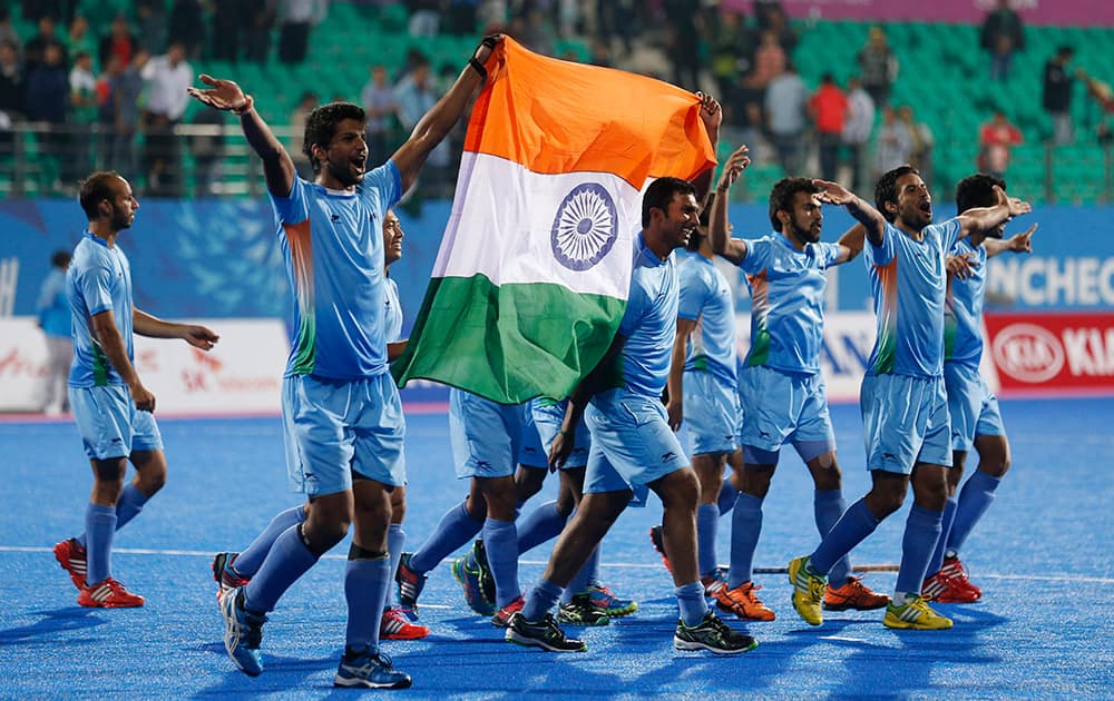 India's team celebrate after winning the men's gold medal hockey match against Pakistan at the 17th Asian Games in Incheon, South Korea.