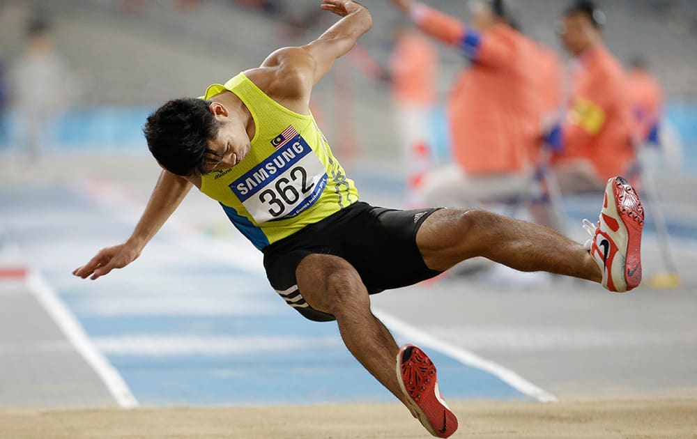 Malaysia's Muhammad Hakimi Bin Ismail competes in the men's triple jump final at the 17th Asian Games in Incheon.