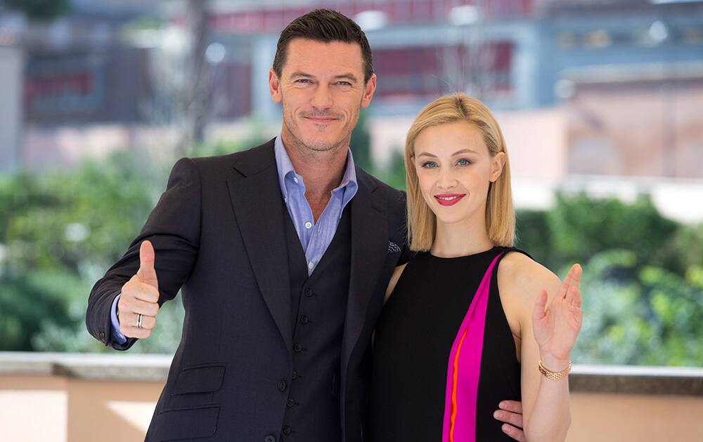 Actors Luke Evans and Sarah Gadon pose for photographers during a photo call to present the movie 'Dracula Untold', in Rome.