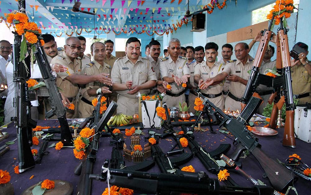 Police personnel worship their weapons on the occasion of Dusshera in Thane.