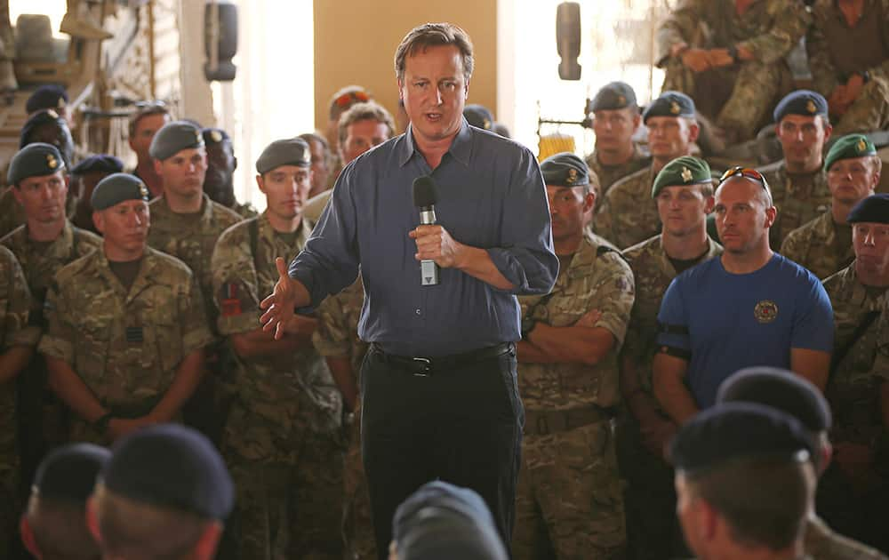 Britain's Prime Minister David Cameron, addresses British troops, in Camp Bastion, Afghanistan.