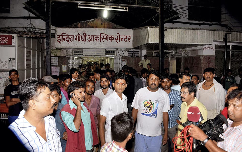 People gather outside a hospital after stampede during Dussehra function in Patna Gandhi maidan.