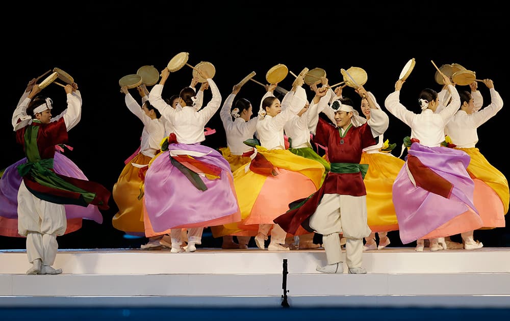 Dancers perform during the closing ceremony of the 17th Asian Games in Incheon, South Korea.