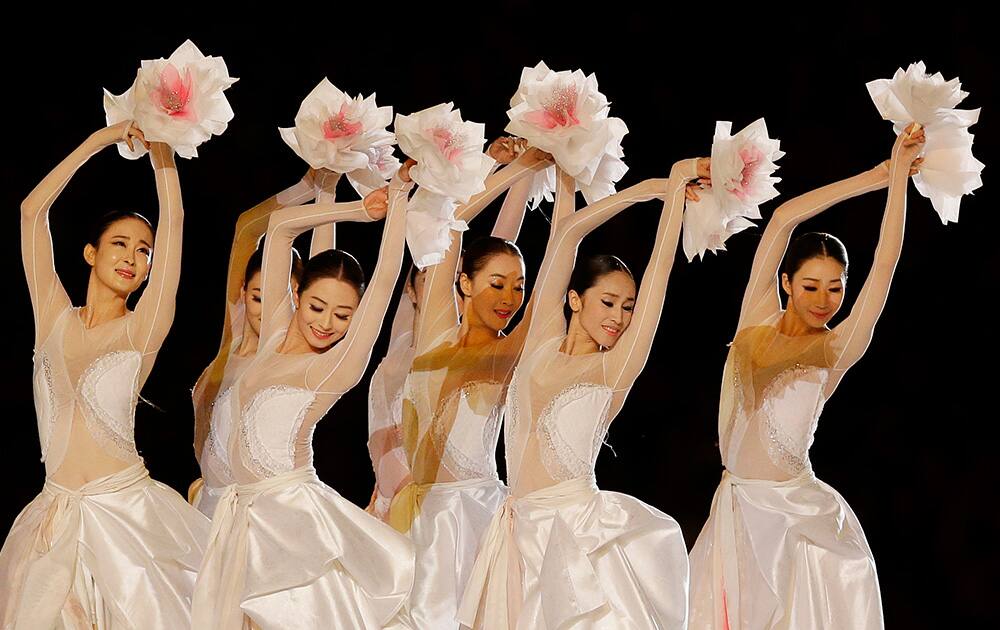 Dancers perform during the closing ceremony of the 17th Asian Games in Incheon, South Korea.