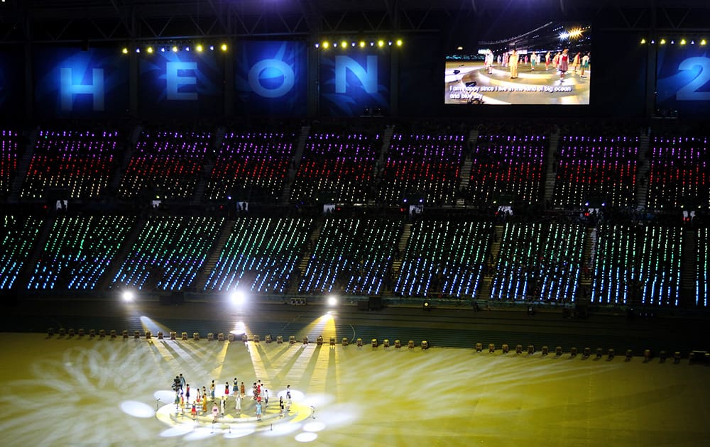 Dancers perform during the closing ceremony of the 17th Asian Games in Incheon, South Korea.