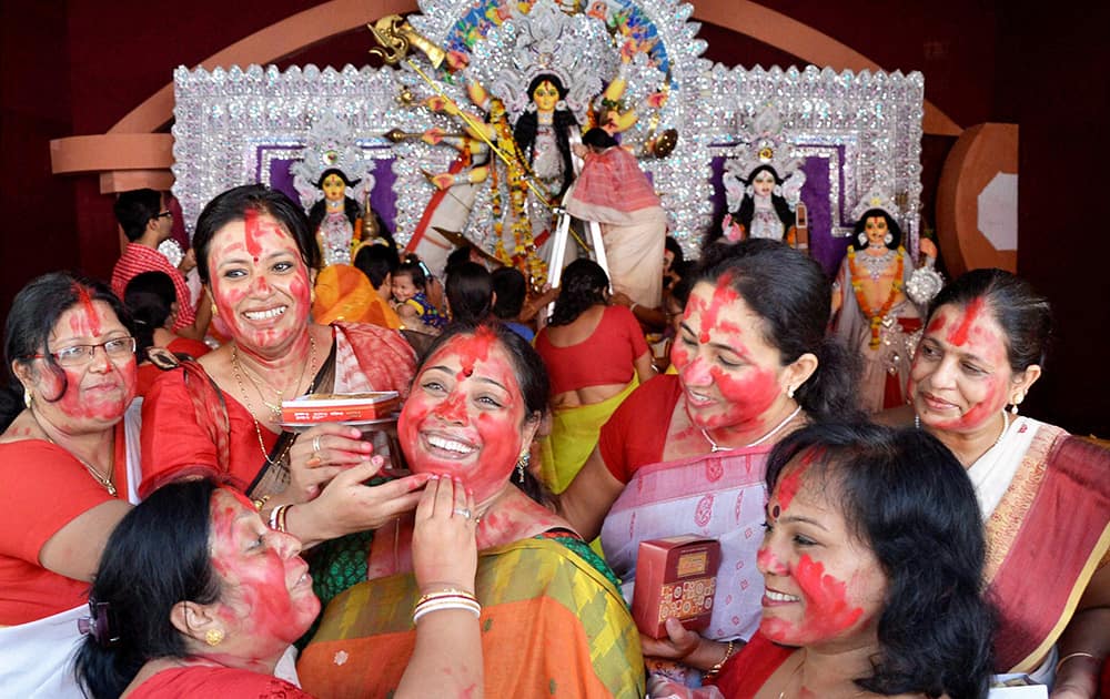 Married Bengali women take part in Sindur Khela on the last day of Durga Puja festival at Kalibari in Bhopal.