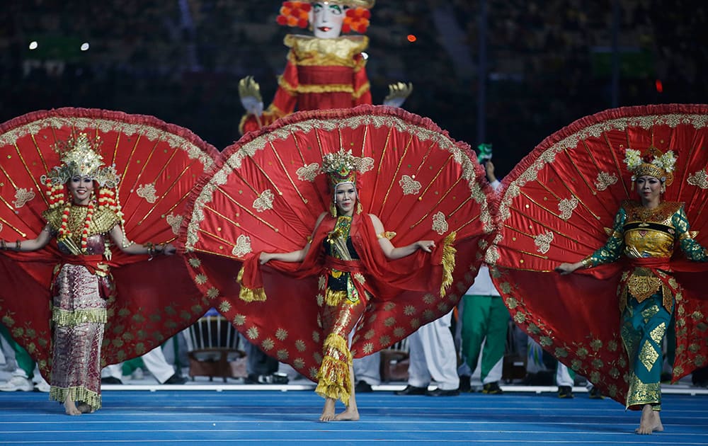 Dancers from the next host country Indonesia perform during the closing ceremony of the 17th Asian Games in Incheon, South Korea