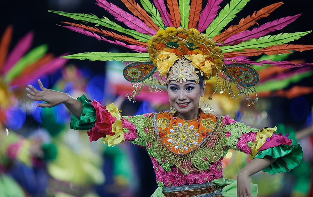 Dancers from the next host country Indonesia perform during the closing ceremony of the 17th Asian Games in Incheon, South Korea.