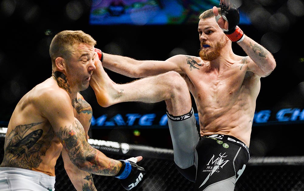 Mike Wilkinson, left, of England gets a kick to the head from Niclas Backstrom of Sweden in a featherweight Mixed Martial Arts bout during the Ultimate Fighting Championship (UFC) gala at the Globe Arena in Stockholm, Sweden.