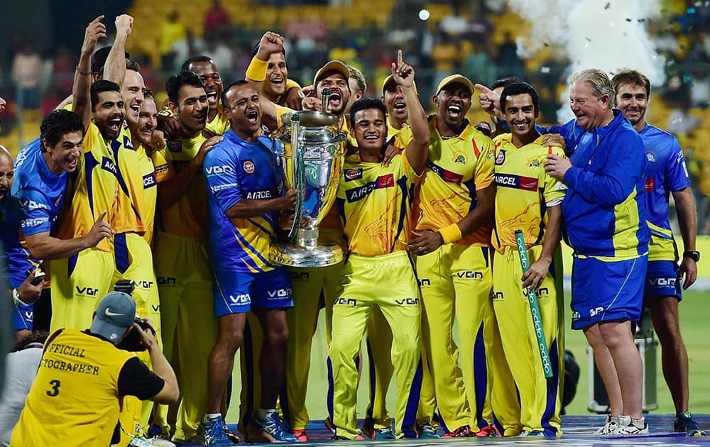 Chennai Super Kings players with CLT20 trophy after winning against Kolkata Knight Riders at Chinnaswamy Stadium in Bengaluru.