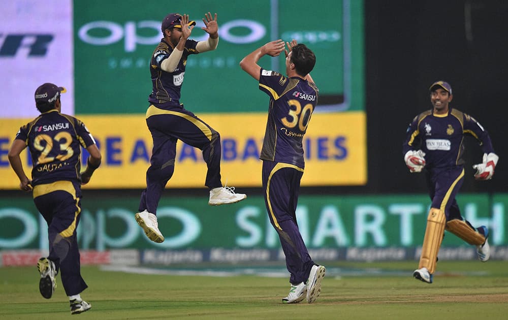 Kolkata Knight Riders bowler Patrick Cummins celebrates the wicket of Chennai Super Kings batsman Dwayne Smith during the CLT20 final match at Chinnaswamy Satdium in Bengaluru.