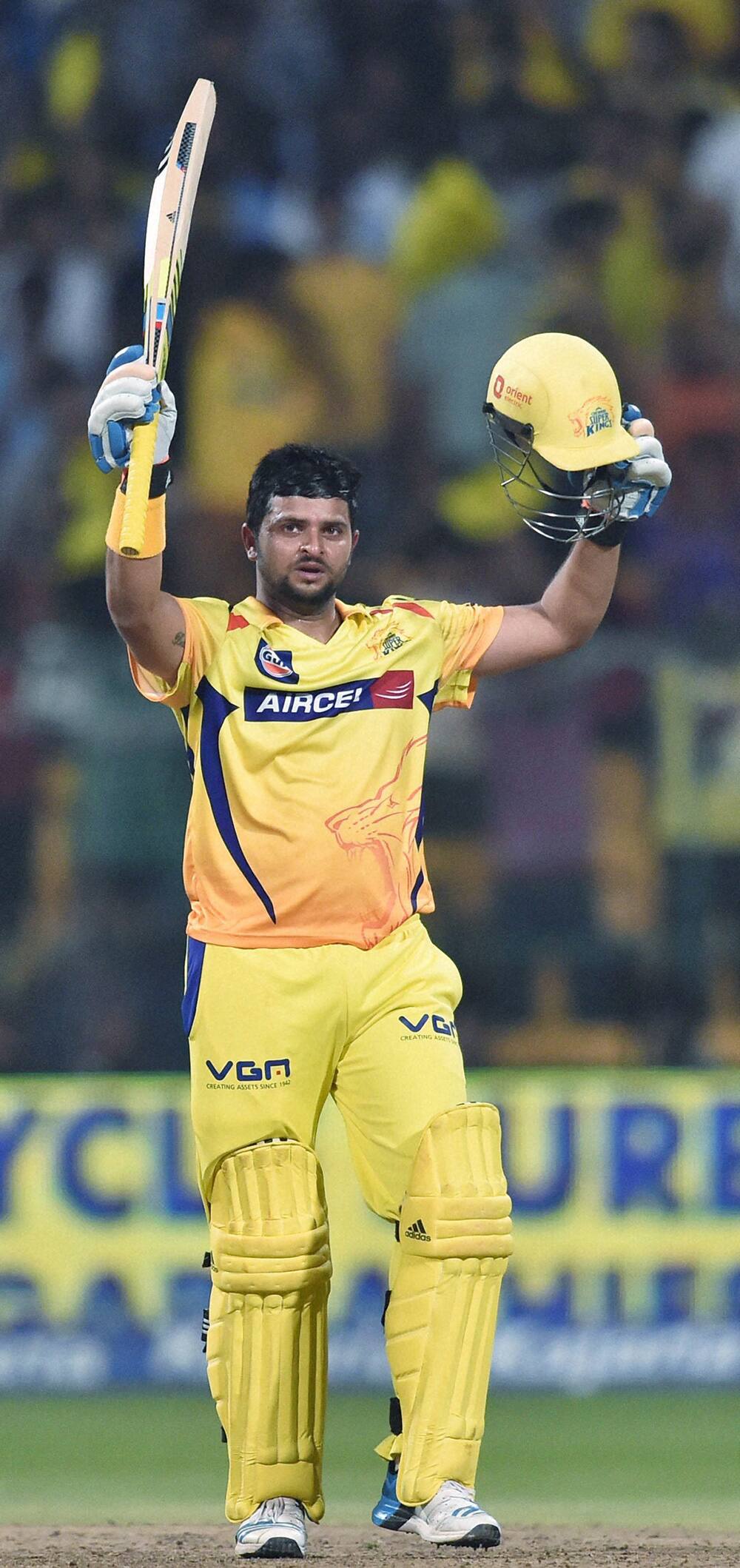 Chennai Super Kings batsman Suresh Raina celebrates his century during the CLT20 final match against Kolkata Knight Riders at Chinnaswamy Satdium in Bengaluru.