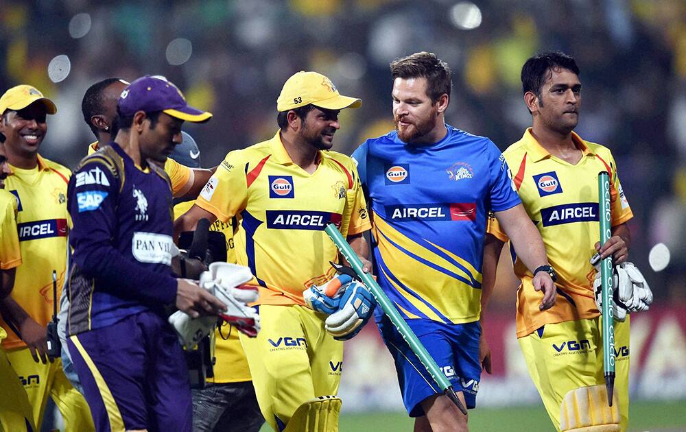 Chennai Super Kings batsman M S Dhoni,Suresh Raina with team mates celebrates the win during the CLT20 final match against Kolkata Knight Riders at Chinnaswamy Stadium in Bengaluru.