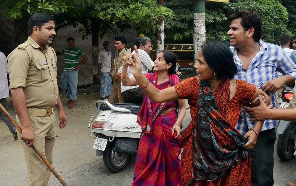 Relatives protest against the police after an Inter college student went missing and was later found dead in Moradabad.