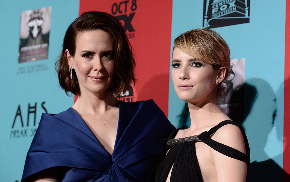 Sarah Paulson and Emma Roberts arrive at the premiere screening of 'American Horror Story: Freak Show' at the TCL Chinese Theatre in Los Angeles.