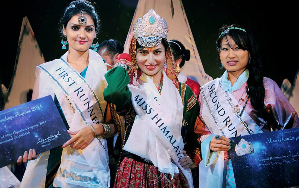 Jyoti Dogra, winner of Miss Himalaya Pageant 2014 with runner ups Shikha Sharma(L) and Dawa Dema(R) in McLeod Ganj near Dharamsala.