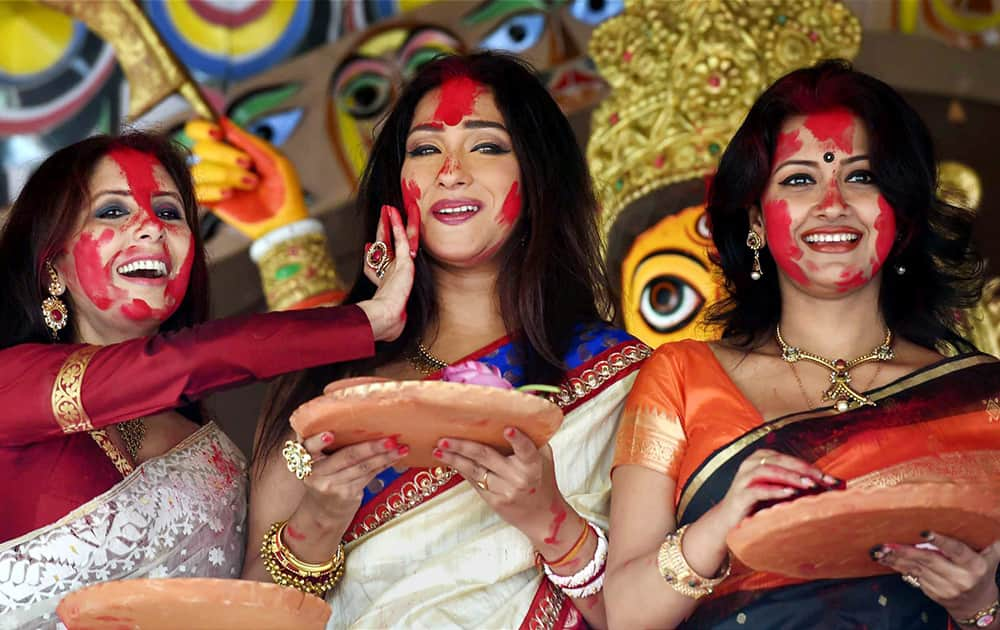 Tollywood actresses Rituparna Sengupta (C) Rachana Banerjee (R)and Chaiti Ghosal (L) celebrate Sindur Khela during Bijaya Dashami in Kolkata.