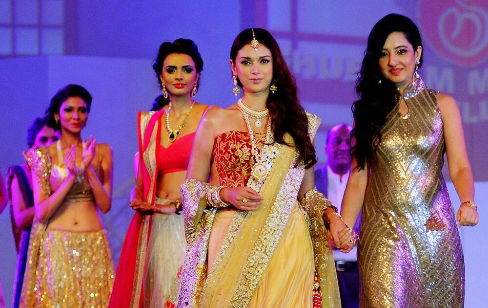 Bollywood actress Aditi Rao Hydari walks down the ramp as she displays designer Amy Billimoria collection during a fashion show in Mumbai.